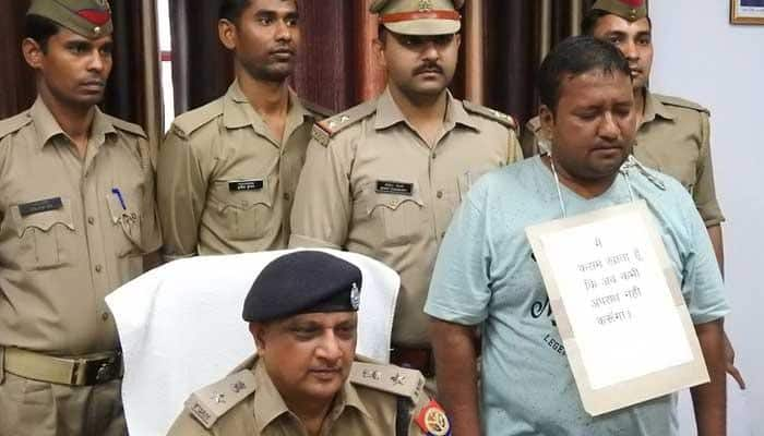 Criminal surrenders wearing placard saying &#039;won&#039;t commit crime again, don&#039;t shoot me&#039; in UP&#039;s Amroha