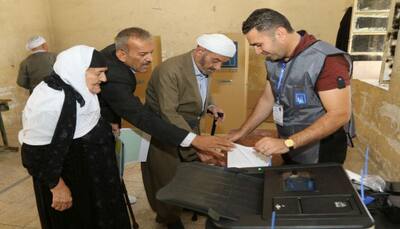 Iraqis vote as Abadi seeks to fend off Iran-backed rivals
