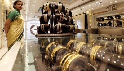 Gold slumps by Rs 430 on muted demand, weak global cues