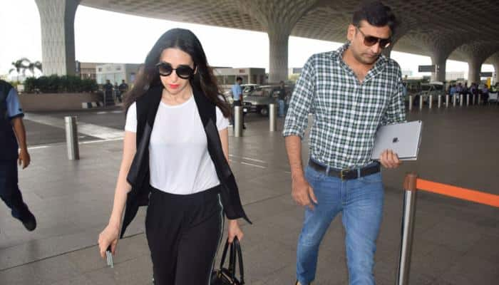 Karisma Kapoor spotted with rumoured beau Sandeep Toshniwal at the airport—See pics