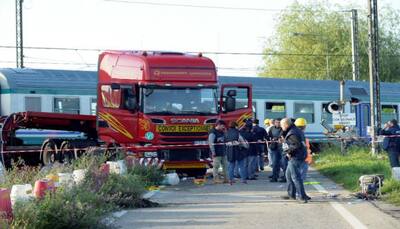 Two dead, 18 injured after train crashes into lorry in Italy