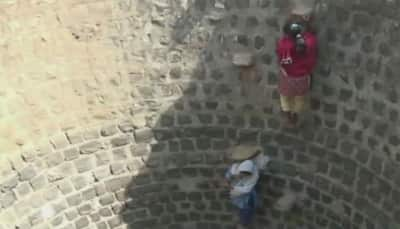 Watch: Water crisis forces children in MP village to walk 1 kilometer and climb down well