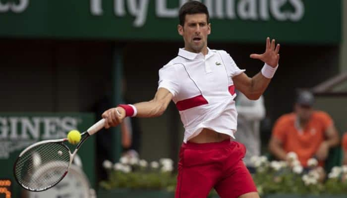 Novak Djokovic&#039;s bid for second French Open off to glum-faced start