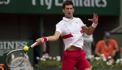 Novak Djokovic's bid for second French Open off to glum-faced start