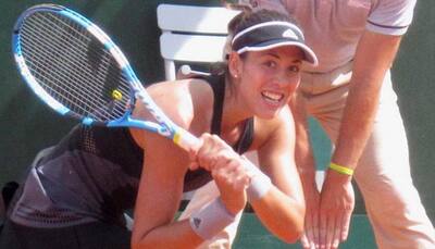 French Open: Garbine Muguruza through as Lesia Tsurenko retires hurt