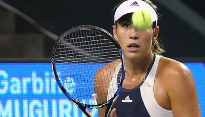French Open: Garbine Muguruza through as Tsurenko retires hurt