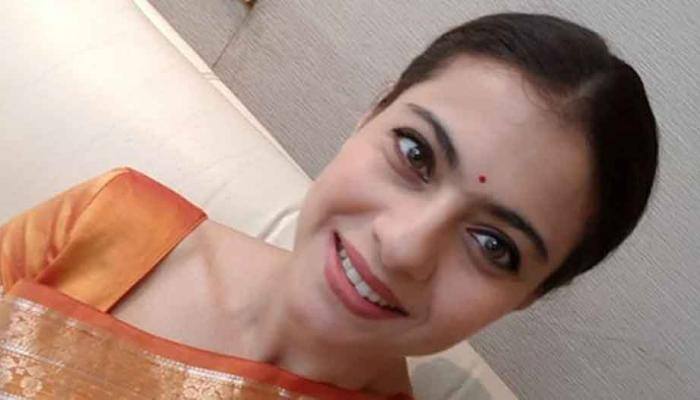 Ajay Devgn much better than me at pampering kids: Kajol