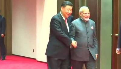 In Qingdao, China's Xi Jinping greets PM Narendra Modi with a handshake and smile ahead of SCO Summit