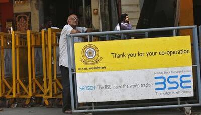 Sensex closes flat, Nifty comes below 10,800