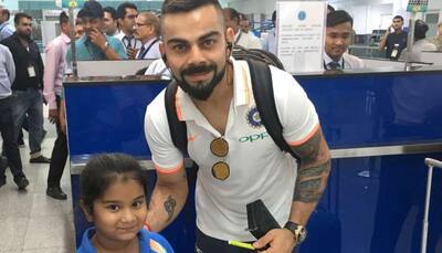 Virat Kohli poses with a little fan at airport before leaving for England tour, makes her day