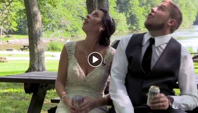 Newlyweds barely escape being struck by tree branch, video goes viral—Watch