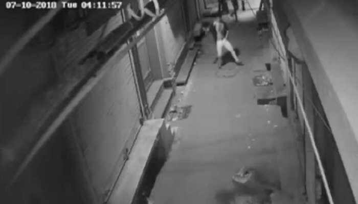 Thief caught on camera dancing before attempting to break into a shop in Delhi 