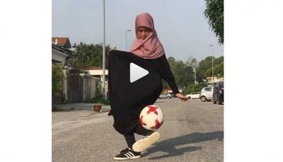 Is it Messi or Ronaldo? No, a burqa-clad girl displaying football tricks -Watch
