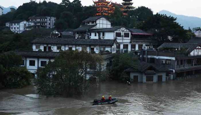 China floods wreak havoc, block roads and railways; more rain due
