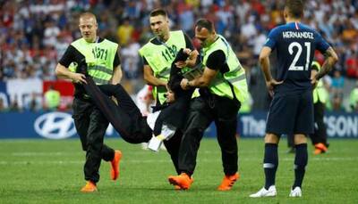 Intruders run on to pitch during World Cup final, Pussy Riot punk band claims responsibility