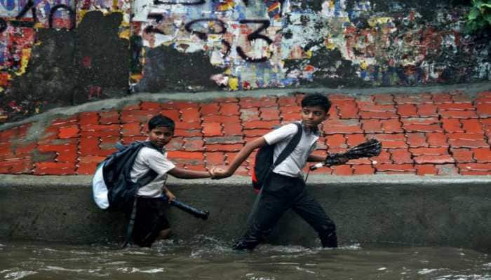 Mumbai rain live updates: Overcast sky gives way to heavy downpour