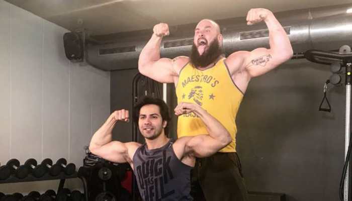 Varun Dhawan got into a 'muscle flexing contest' with WWE monster Braun Strowman. Guess who won?
