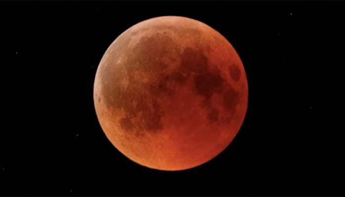 &#039;Blood moon&#039; dazzles skygazers in century&#039;s longest eclipse