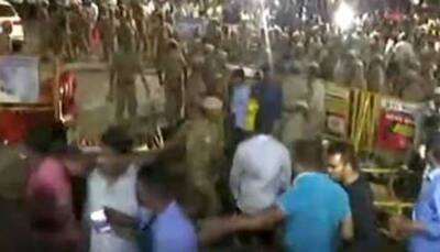 Well-wishers of M Karunanidhi lathi charged outside Chennai hospital