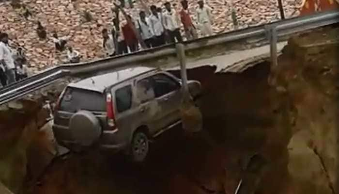 Newly-bought SUV falls into 50 feet deep pit on Agra-Lucknow expressway after road caves in - Watch