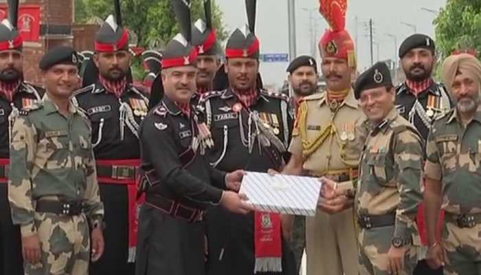 India's Border Security Force and Pakistan Rangers share sweets at Attari-Wagah border