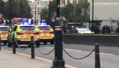 Car crashes into UK parliament barriers, several pedestrians injured