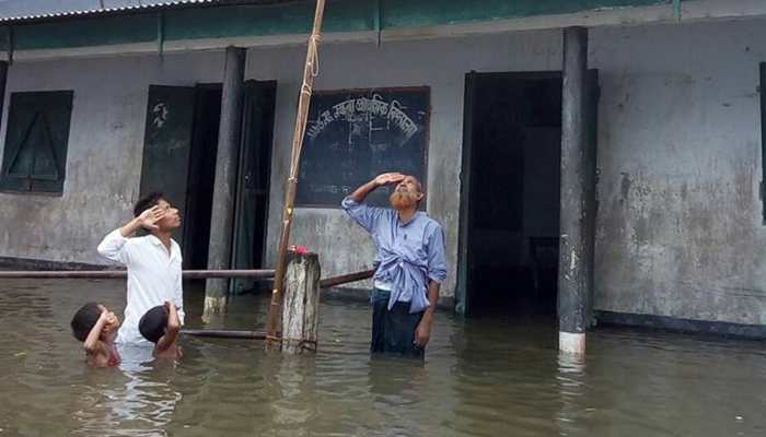 Boy who saluted Tricolour in chest-deep flood water not in Assam NRC draft