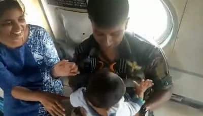 Watch: Garud commando airlifts baby from rooftop, hands it over to mother in flood-ravaged Kerala 