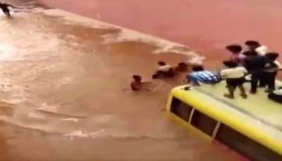 Bus carrying school students submerges in flooded road in Rajasthan — Watch