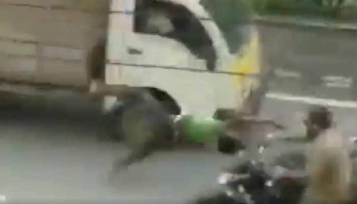Shocking escape: Man on bike flips 360 after head-on collision, walks away unharmed