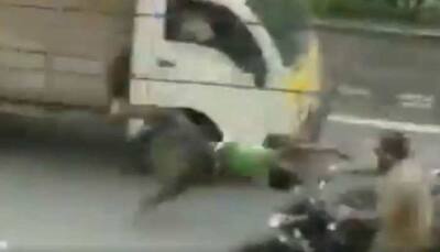 Shocking escape: Man on bike flips 360 after head-on collision, walks away unharmed