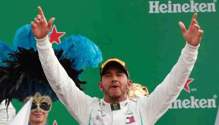 Lewis Hamilton wins as Sebastian Vettel spins in Ferrari&#039;s backyard