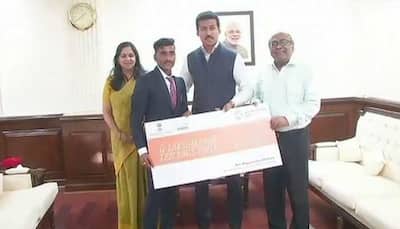 Rajyavardhan Rathore rewards Rs 10 lakh cheque to disqualified athlete Govindan Lakshmanan