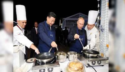 Russian President Vladimir Putin, Chinese prez Xi Jinping turn chefs, flip pancakes in Russia