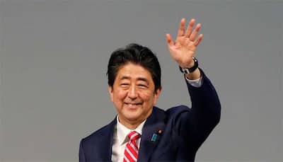 Japanese Prime Minister Shinzo Abe says arranging visit to China next month