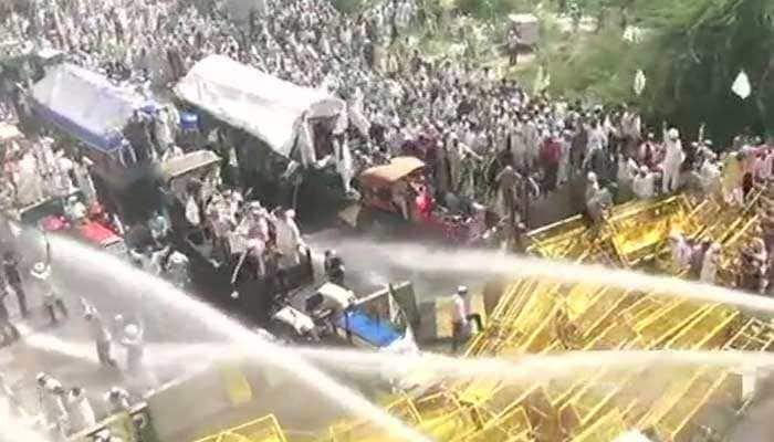 Police use water cannons, tear gas to disperse protesting farmers; AAP, SP and Congress extend support