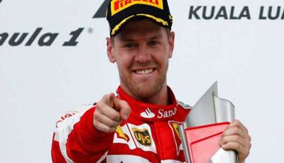 Motor racing: Vettel defends Ferrari's gamble during Japanese Grand Prix qualifiers