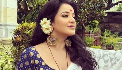 Monalisa sizzles in sheer white saree, enjoys being a 'water baby' - See pics