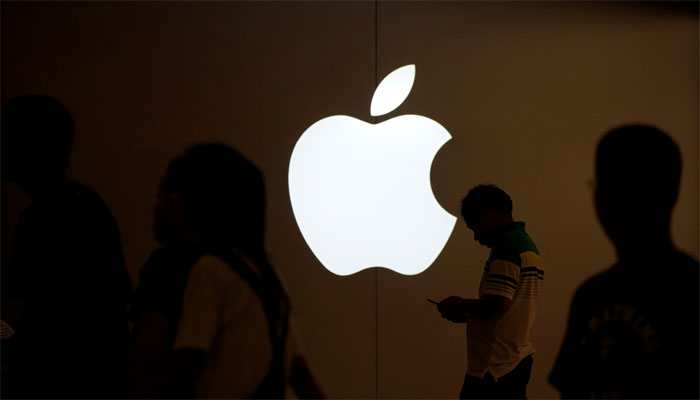 Apple warns on holiday sales, sending value below $1 trillion