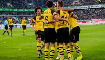 Borussia Dortmund go four points clear with win at Wolfsburg