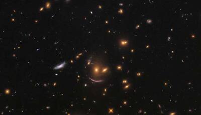 NASA's Hubble telescope finds smiling face among colourful galaxies