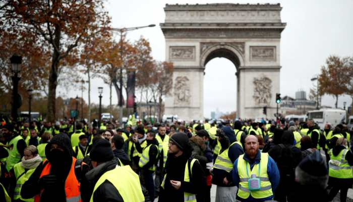 French police fire tear gas at protesters on Champs Elysees