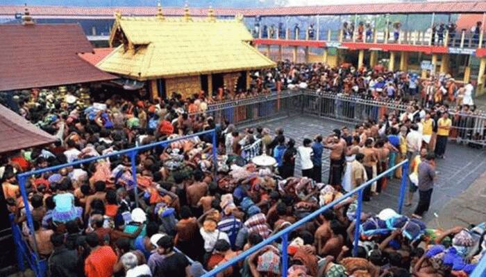 Sabarimala row: 2 women pilgrims stopped by devotees midway to Lord Ayyappa shrine Sabarimala row: 2 women pilgrims stopped by devotees midway to Lord Ayyappa shrine