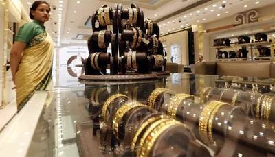 Gold finds lost sheen, jumps Rs 390; silver soars by Rs 800 per kg