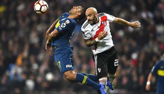 Boca Juniors make quiet return to Argentina following Libertadores loss