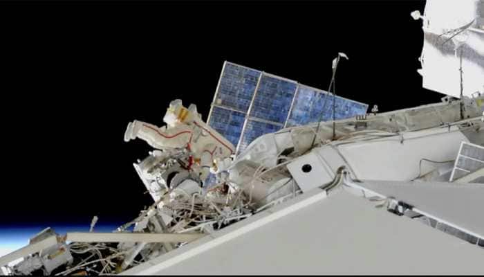 Russian cosmonauts undertake spacewalk to solve mystery of small hole in craft Russian cosmonauts undertake spacewalk to solve mystery of small hole in craft