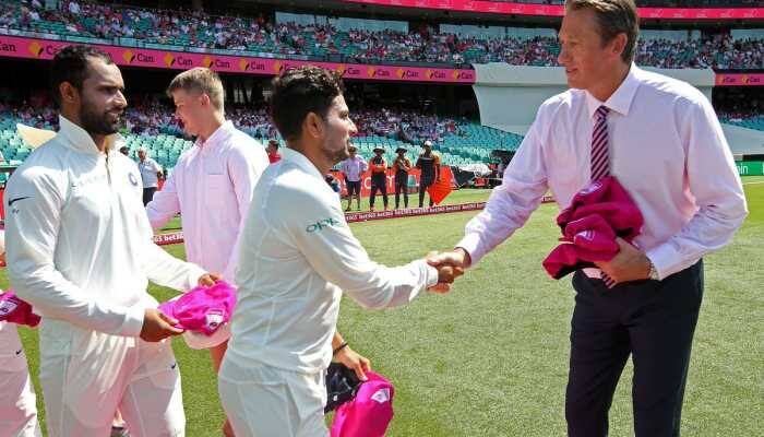 Indian cricketers present signed pink caps to Glenn McGrath in Sydney  