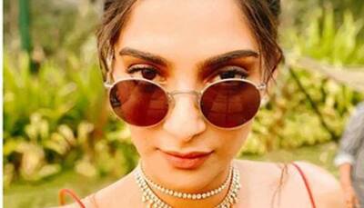 Sonam Kapoor gives style inspiration with a deep-neck tangerine dress—Pics