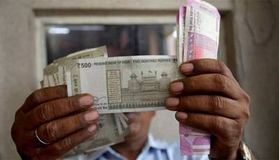 Rupee breaches 71 per dollar on ''chunky outflows''