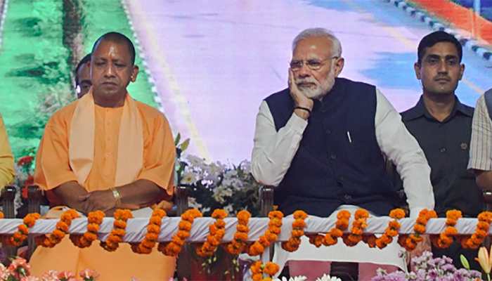 Hoardings with photos of Modi, Adityanath defaced in UP Hoardings with photos of Modi, Adityanath defaced in UP